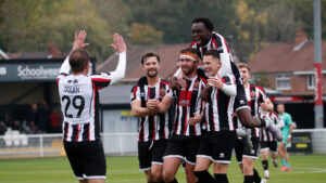 Spennymoor Town players celebrate Dan Rowe's goal against Merthyr Town