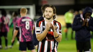 Spennymoor Town defender Dan Jones applauds fans at The Brewery Field