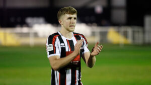 Spennymoor Town midfielder Tom Pugh applauds fans at The Brewery Field