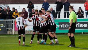 Spennymoor Town striker Glen Taylor celebrates a goal with teammates