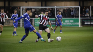 Spennymoor Town midfielder Mitch Hancox in action against Buxton