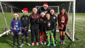 Spennymoor Town goalkeeper Brad James with children at his training session