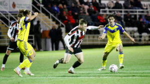 Spennymoor Town midfielder Mackenzie Heaney in action