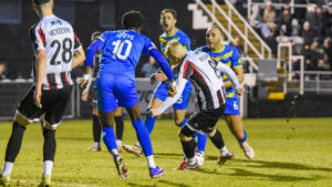 Spennymoor Town midfielder Luke Williams scores against Radcliffe