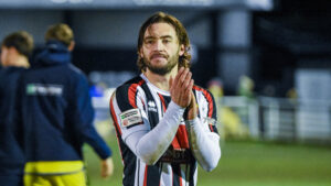 Spennymoor Town defender Dan Jones applauds fans at The Brewery Field