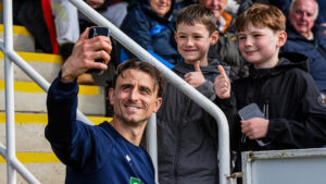 Spennymoor Town striker Glen Taylor takes a selfie with supporters