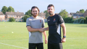 Spennymoor Town midfielder George Cantrill with manager Tommy Miller